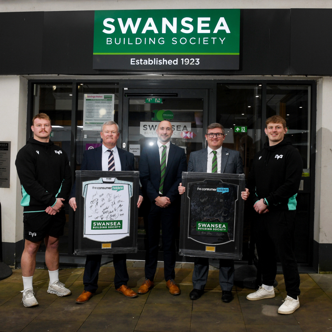 Welsh rugby stars Jac Morgan and Dewi Lake present shirt to manager of our Swansea branch